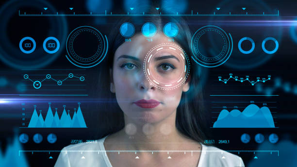 istock The woman is looking at the digital interface, giving attention to specific data on the HUD. This is futuristic, virtual reality, hologram, and technology concept. 1359549863