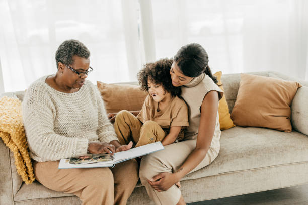 Five steps to save for your child's future Grandmother spending time with daughter and granddaughter afro latinx ethnicity stock pictures, royalty-free photos & images