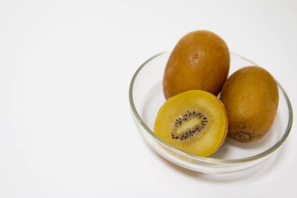 istock Gold kiwifruit on a plate on the table 1359551546
