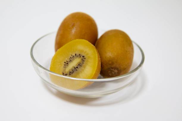 Gold kiwifruit on a plate on the table