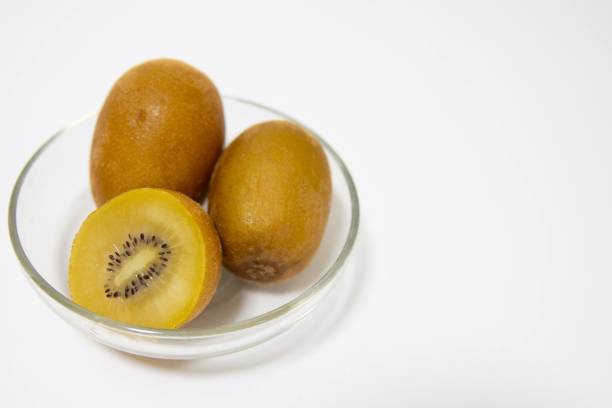 istock Gold kiwifruit on a plate on the table 1359551658