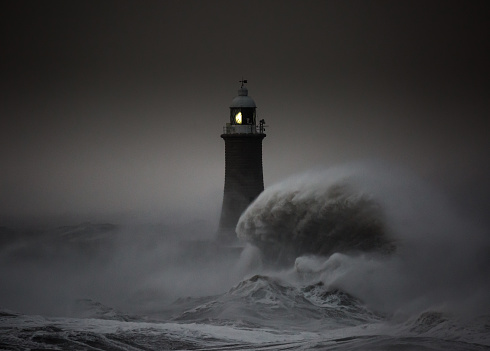 Storm Arwen batters the coastline at Tynemouth, England, with giant waves crashing against the lighthouse in the gale force winds