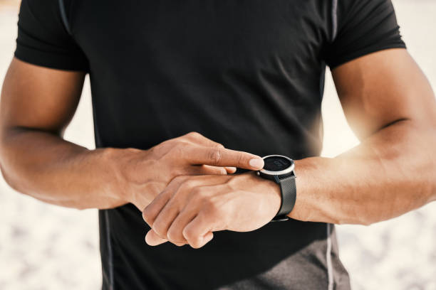 istock Cropped shot of an unrecognizable man checking his watch while out for a workout 1359553820