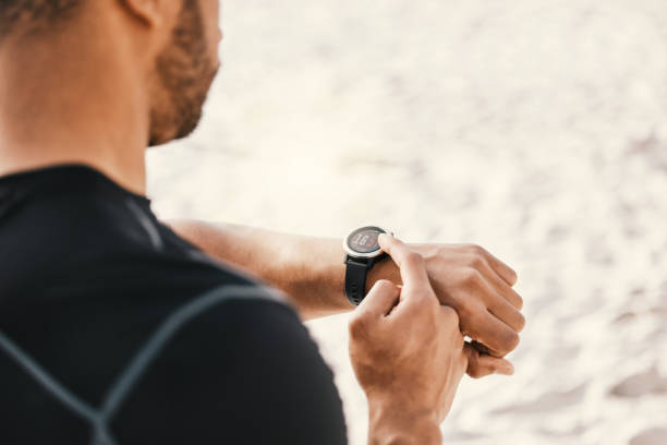 istock Cropped shot of a man checking his watch while out for a workout 1359553858