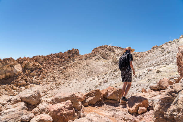 istock Young boy on Trekking path to the top of mount Teide 1359554021