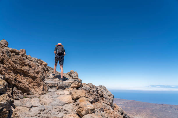 istock Young boy on Trekking path to the top of mount Teide 1359554202