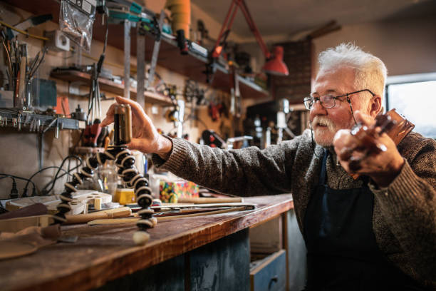 istock senior craftsman making  the violin 1359556099
