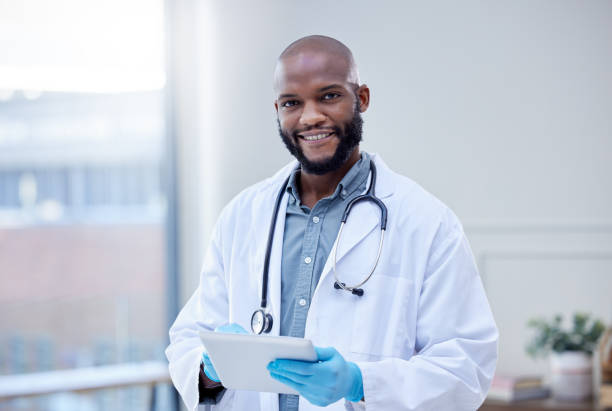 istock Shot of a male doctor using a digital tablet 1359557281
