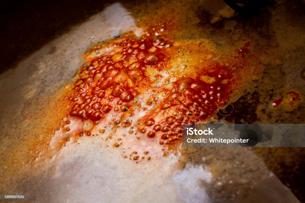 Bubbles formed on the surface during electrolysis rust removal Rusty Stock Photo
