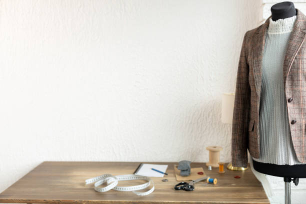 istock Suit jacket on tailor mannequin and sewing tools. Concept of clothes atelier 1359559003