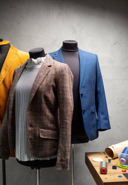 istock Suit jacket at tailor mannequin and sewing tools. Concept of clothes atelier workplace 1359559613