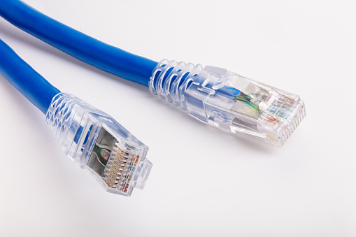 Fiber optics cable for fast communication network services in a warm and blue surrounding.