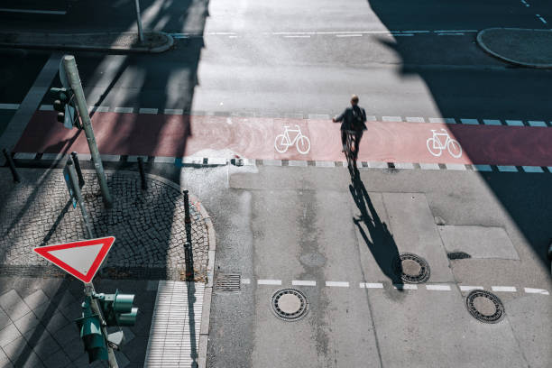 istock men on bicycle on crossroad in berlin 1359560144