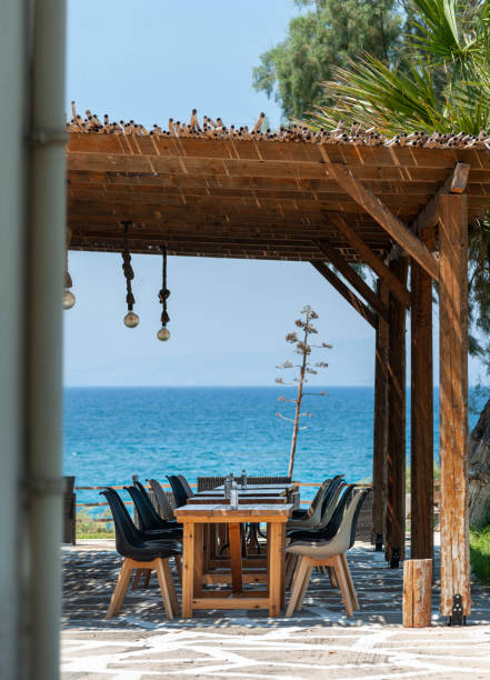 istock Cozy cafe or restaurant on the seashore, sunshine 1359560148