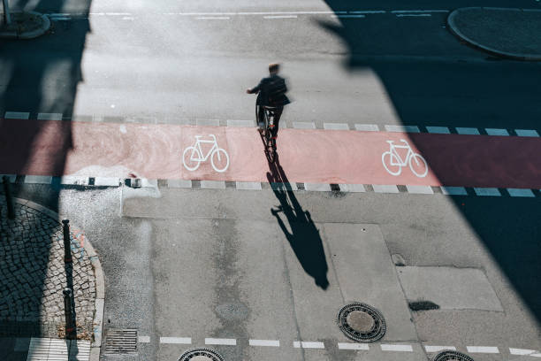 istock men on bicycle on crossroad in berlin 1359560193