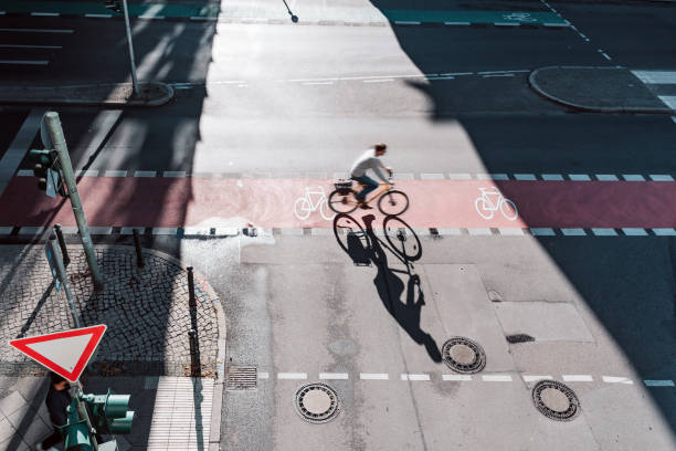 istock men on bicycle on crossroad in berlin 1359560714