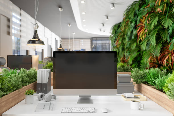 istock Blank Screen Computer Monitor On The Table In Eco-Friendly Open Plan Modern Office With Creeper Plants And Vertical Garden 1359560897