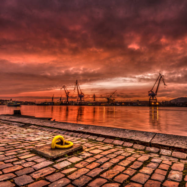Gothenburg, Sweden - February 27 2015: Cranes by the river at sunset .