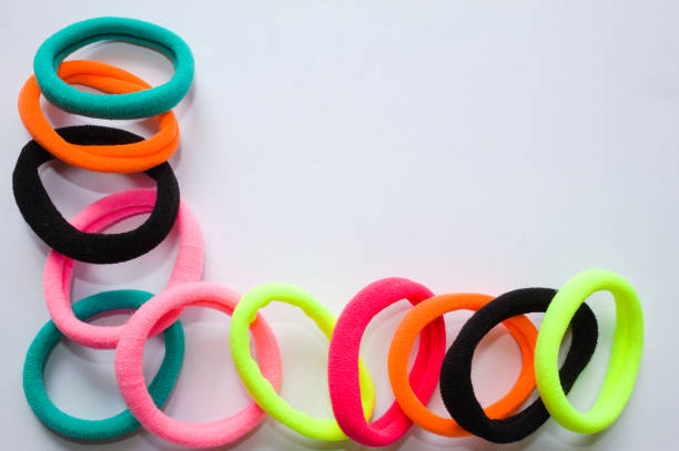 istock Elastic for hair with several colors and white background 1359565792