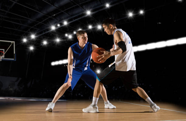 istock Two basketball players in action 1359568329