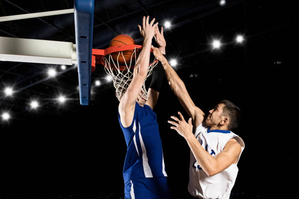 istock Two basketball players in action 1359568332