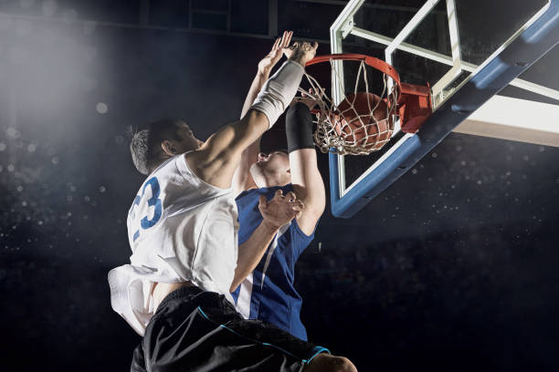 istock Two basketball players in action 1359568334