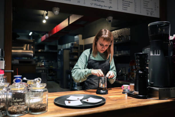 istock Barista Preparing Coffee, Working Woman 1359570276