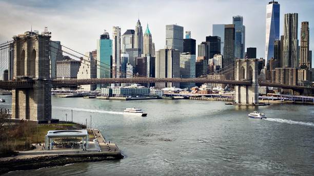 istock Brooklyn Bridge, East River, Lower Manhattan and Ferry Boat 1359570495