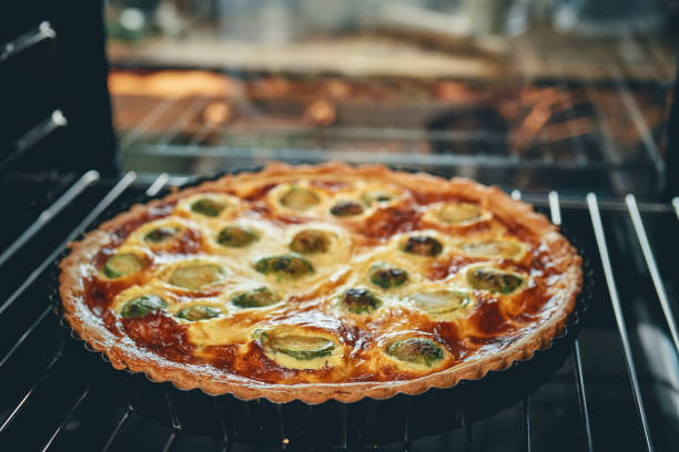 Spinach and ricotta quiche, sliced into portions, on transparent background. Concept of savory pastry and gourmet food
