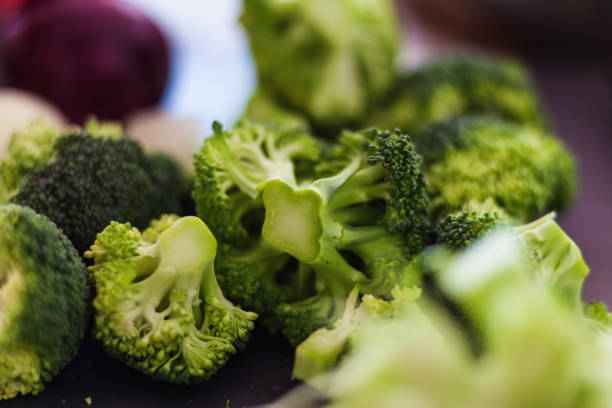 istock Broccoli head cut onto small pieces, close-up 1359573483