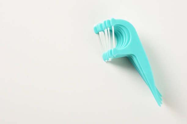 istock Dental floss toothpicks on the white background 1359574190