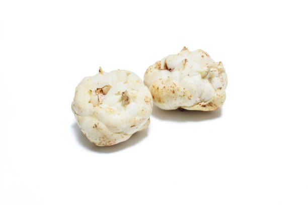 Basket of mushrooms (champignon, cut feet, Agaricus Bisporus) raw (uncooked). With several ingredients (olive oil, garlic and chilli pepper). Isolated on white background.