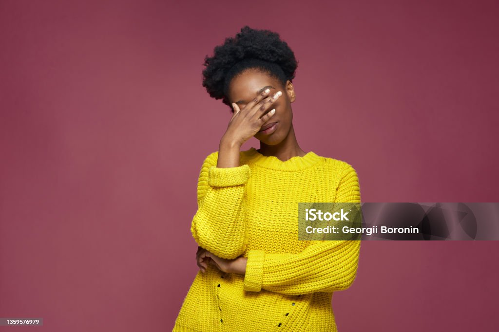 Facepalm gesture. Embarrassed african american girl with hand on face be shy, feeling regret blaming herself for failure Facepalm gesture. Embarrassed african american girl with hand on face be shy, feeling sorrow regret blaming herself for failure. High quality photo Embarrassment Stock Photo