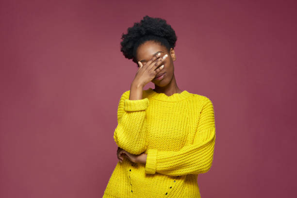 facepalm gesture. embarrassed african american girl with hand on face be shy, feeling regret blaming herself for failure - head in hands imagens e fotografias de stock