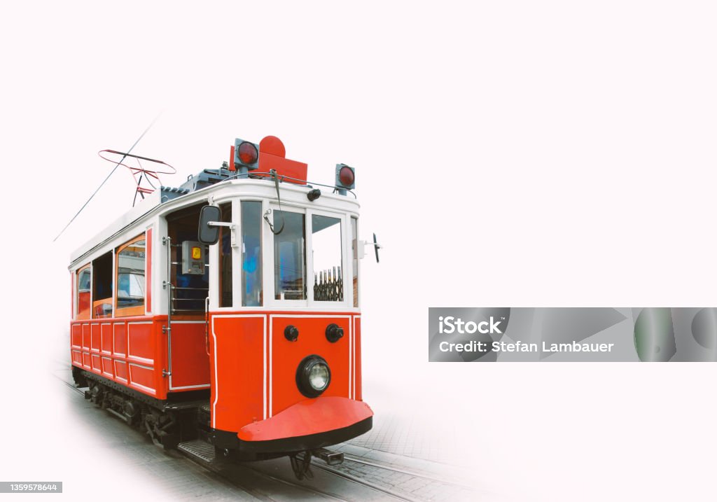 Istanbul, turkey. Electric tram from Taksim square. Traditional electric tram. Red wooden tram in Taksim square. Isolated on white background with space for text. Istanbul, turkey. Cable Car Stock Photo