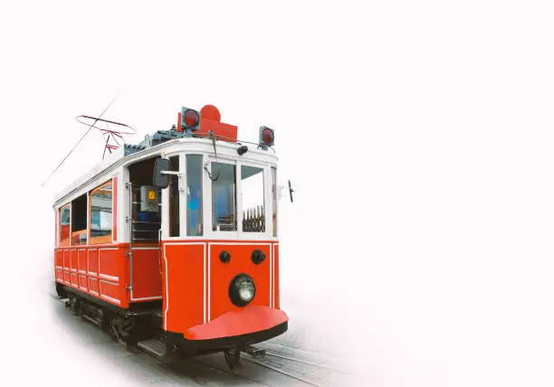 Traditional electric tram. Red wooden tram in Taksim square. Isolated on white background with space for text. Istanbul, turkey.