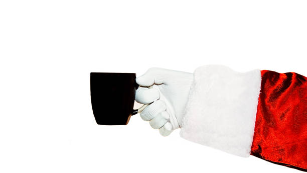 istock Santa Claus is holding a black cup on a white background in his hand. Isolate. 1359579582