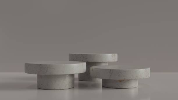 istock Beige color and round marble exhibition stands. 1359580578
