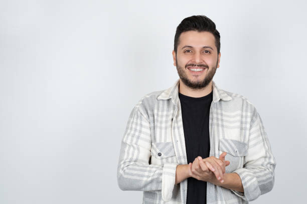 istock Man with crossed arms isolated on gray background 1359580656