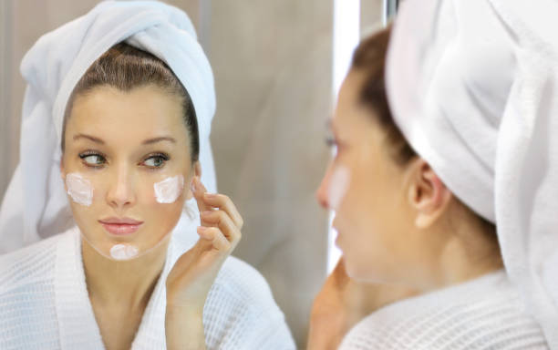 istock Magic anti-aging cream.Applying the cream. 1359582466