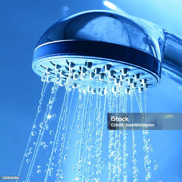 Water Coming From A Shower Head Stock Photo - Download Image Now - Shower Head, Bathroom, Blue