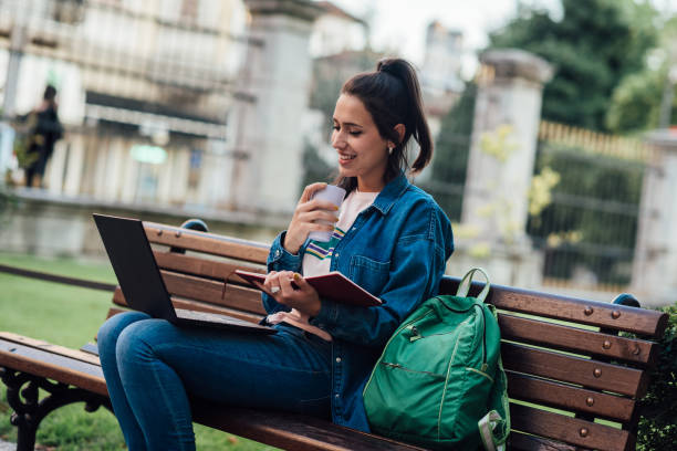 istock Girl using her laptop for learning outdoors 1359584072
