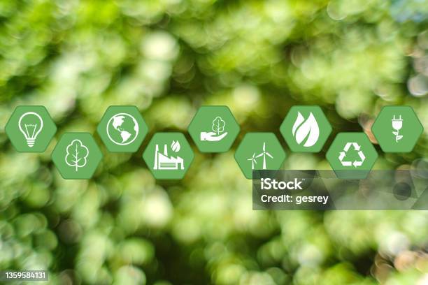 The Concept Of Caring For The Environment Using Ecological Production And Energy With Icons On A Green Background Stock Photo - Download Image Now