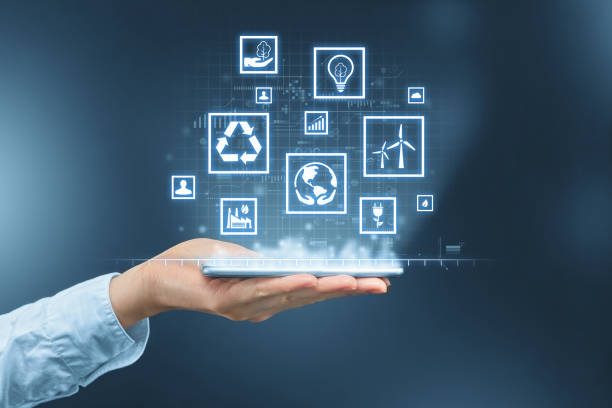 istock Concept of a hand holding a smartphone with ecological technologies for nature conservation. 1359584138