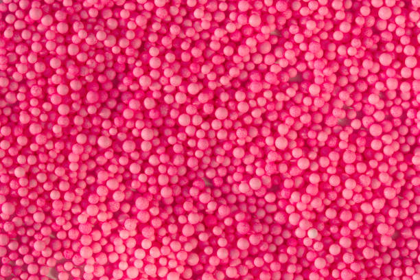 many pink little balls for children playground. cosmetics powder. candy sprinkles - ball pool imagens e fotografias de stock