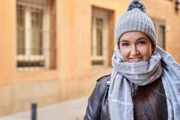 istock Merry young female in knitted hat 1359588399