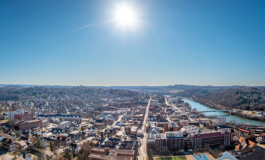 Aerial drone panoramic shot of the downtown area of Morgantown with the WVU campus in the early winter