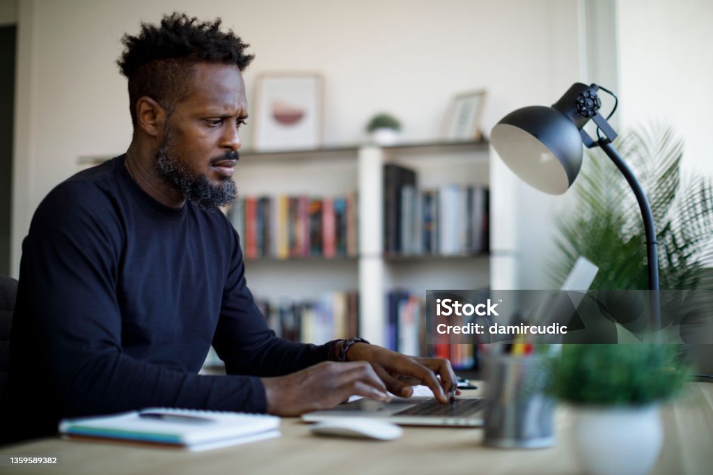 Man working at home office Web Design Stock Photo