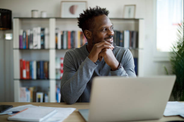 istock Happy smiling man looking away 1359589443
