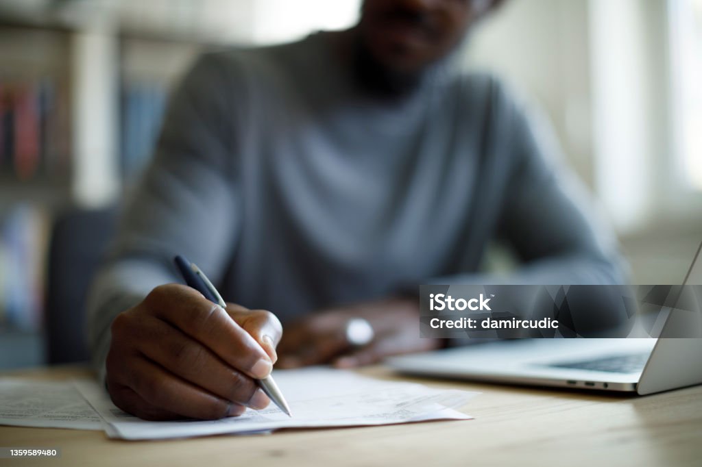 Man working Writing - Activity Stock Photo